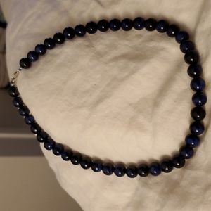 18" round Lapis strand. Has an extendor.